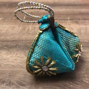 Turquoise bangle bag with zipper and snap close
